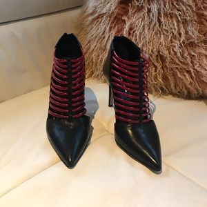 Black and red leather pointed heels